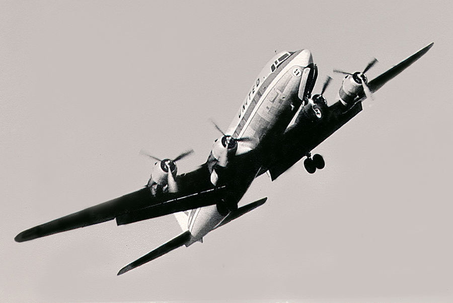 DC-6 or DC-7 taking off out of Sacramento's Execut...
