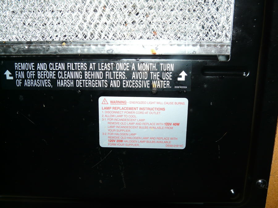 Microwave light label on bottom of mic between sto...