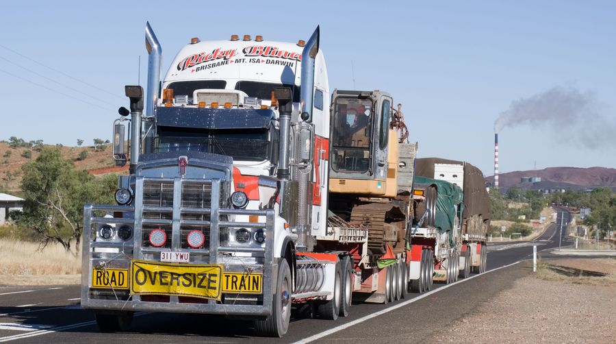 A triple road train with oversize load....