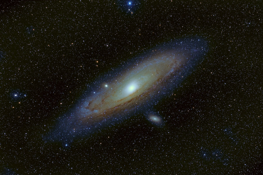 Andromeda and it two satellite galaxies, M110 belo...