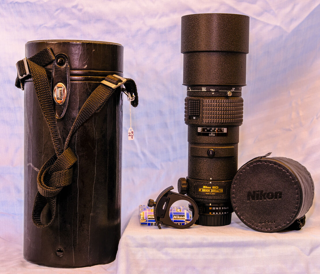 Item 5.  AF 300 f/4 D ED IF.  The case on this ite...