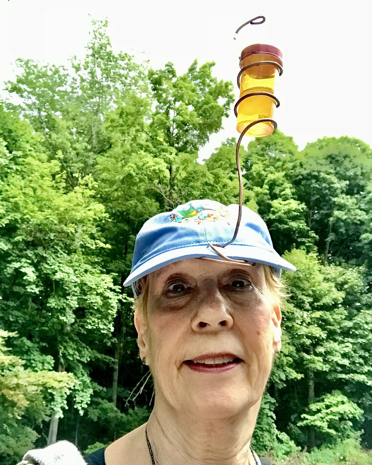 Grand daughter gave me a hummming bird hat!   Tell...