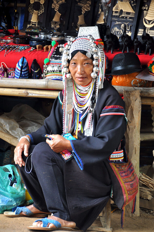 7 - A woman at a souvenir stall, wearing the tradi...