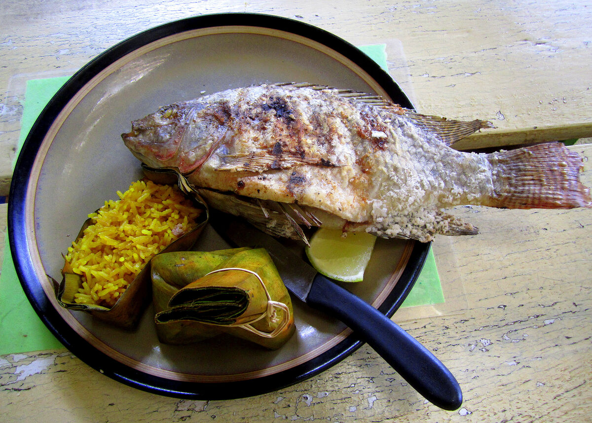 4 - At lunch: Local river fish as a main course op...