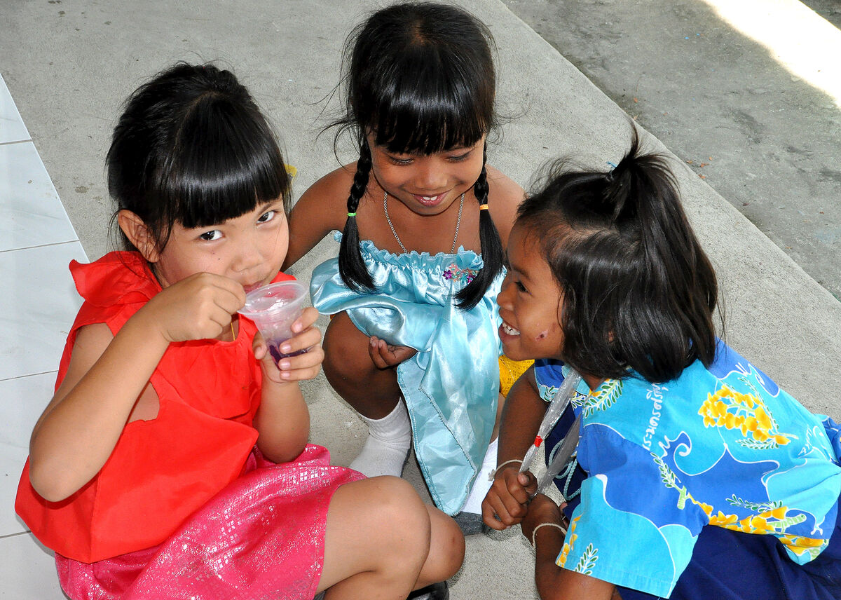 4 - Three young girls giggling after lunch...