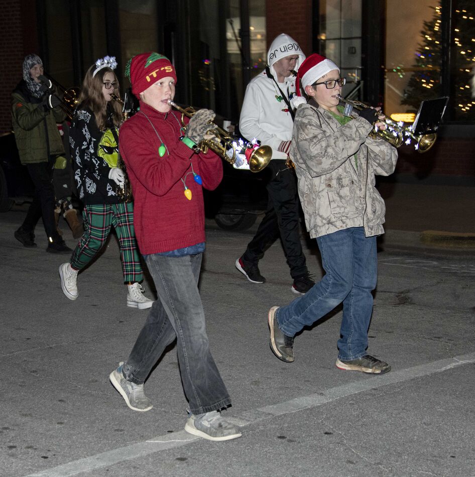 Grandson marching in the Christmas parade.  He is ...