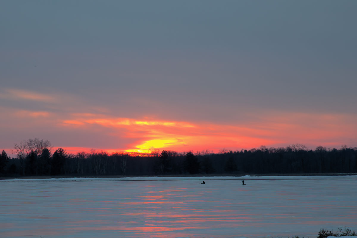 Ice fisherman at sunset...