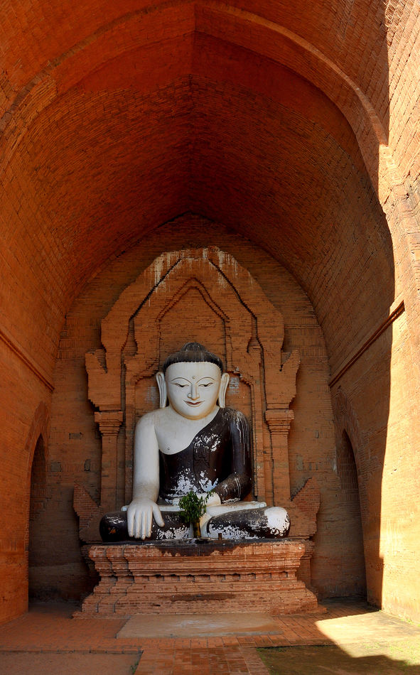 8 - Statue of a sitting Buddha with a rather unusu...