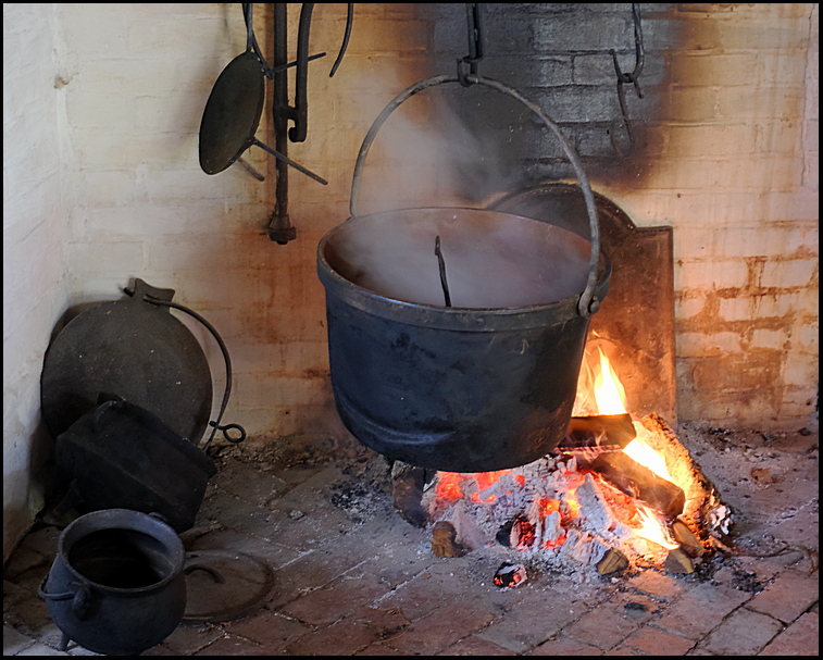 3. Cast iron pot over fire....