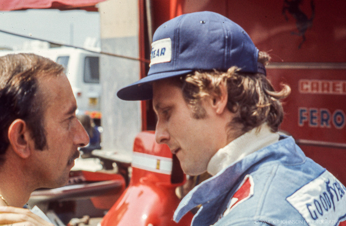Niki Lauda conferring with Ferrari's chief mechani...