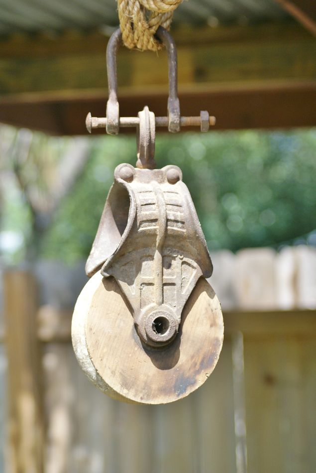 I retrieved this old pulley from the peak of my gr...