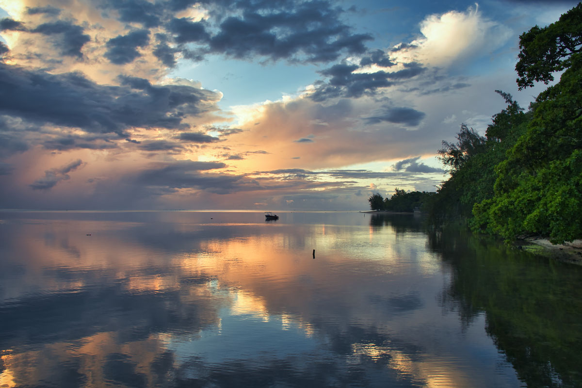 Sunset over the lagoon at the island of Moorea (Fr...