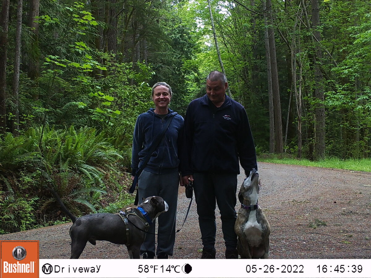 My wife Amy, our dogs and I captured by a trail ca...