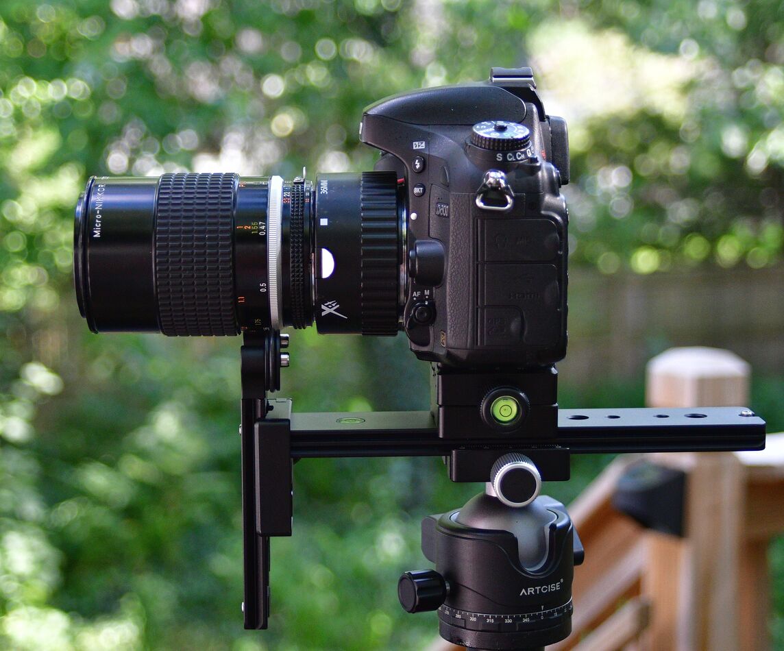 Lens support rail  mounted directly to the ballhea...