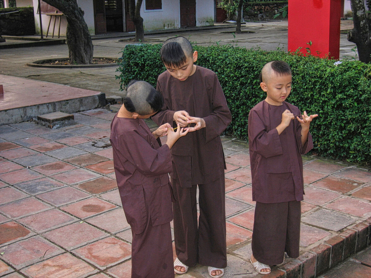 Young Monks in Training play the "cat's cradle" ga...