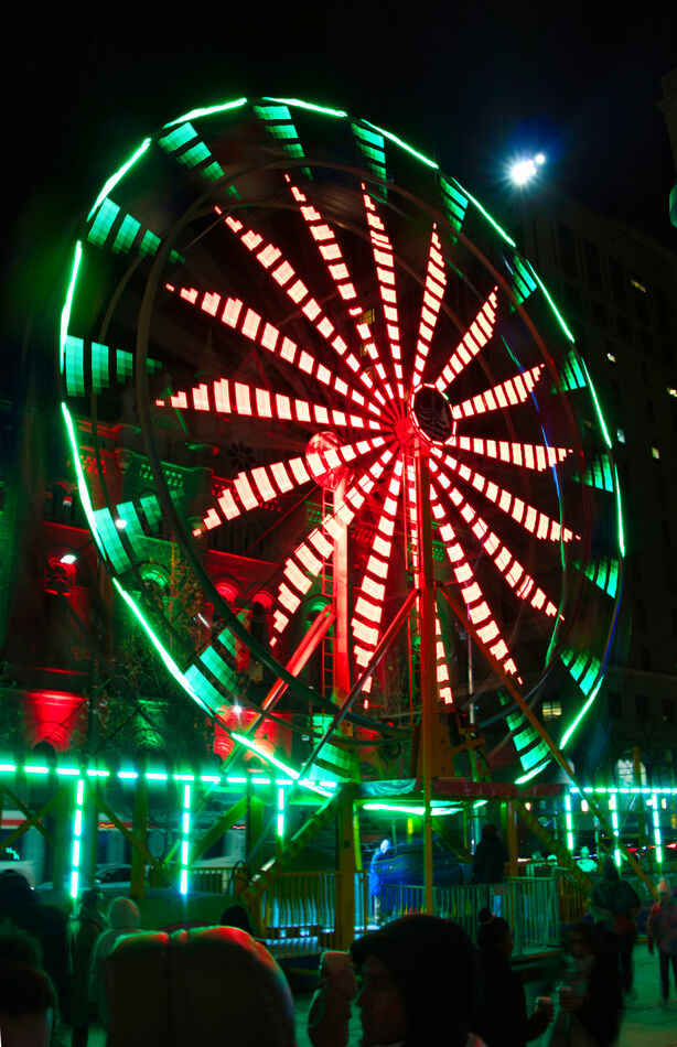 One second exposure of a Ferris wheel, camera held...