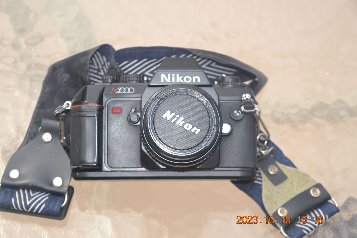 N2000 with 50mm lens and Camera Strap (Included)...