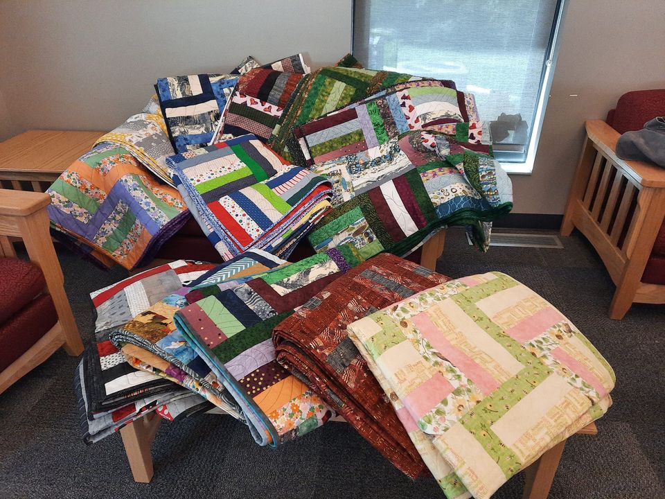 13 quilts delivered to Youth Camp...
