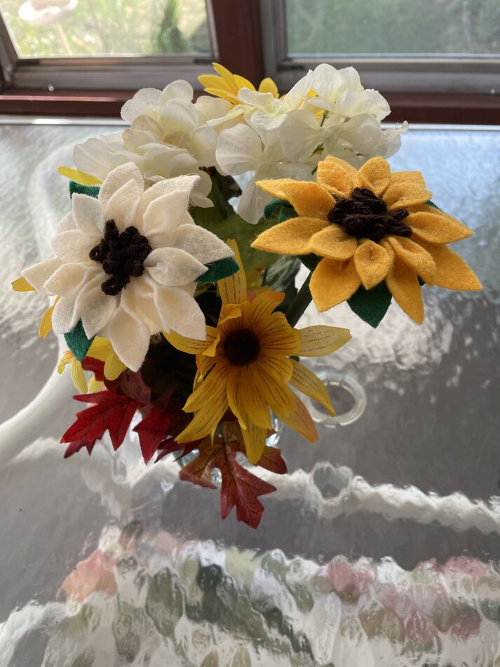 Here are a gold sunflower & white sunflower in the...