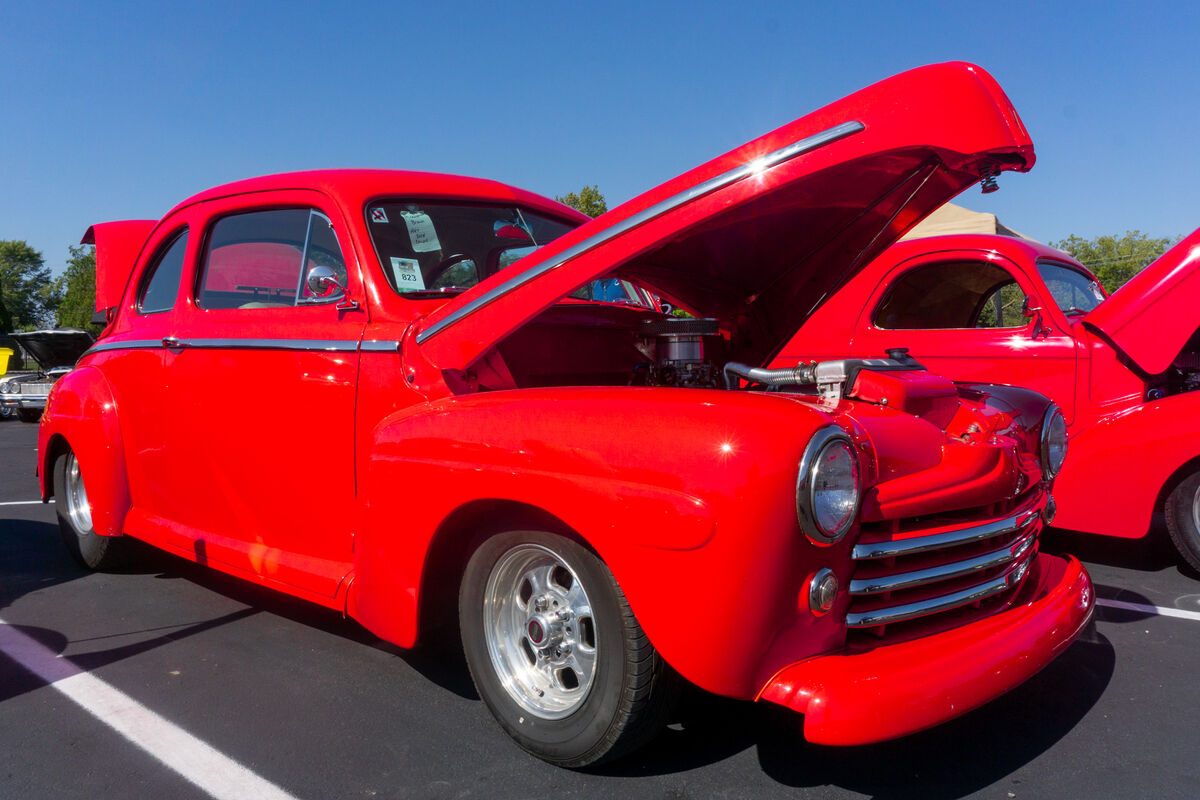 1947 Ford Coupe with a 1941 Willys behind it...