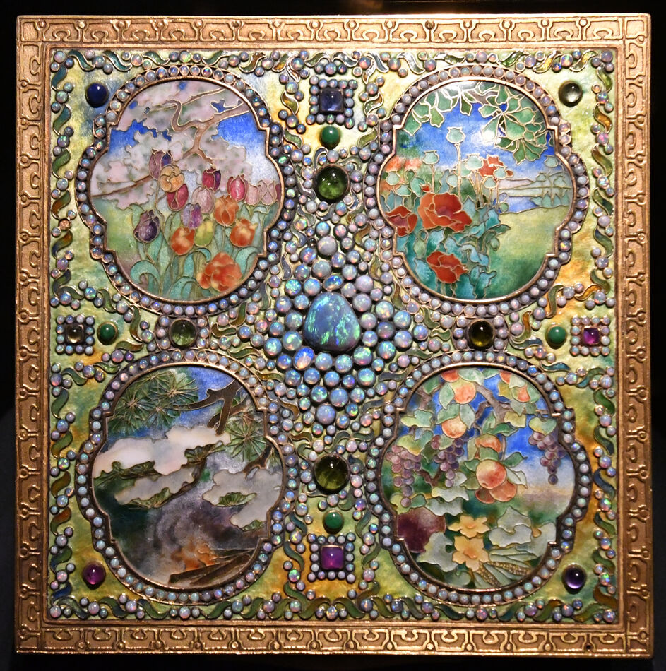 All four seasons are depicted in this panel of sta...