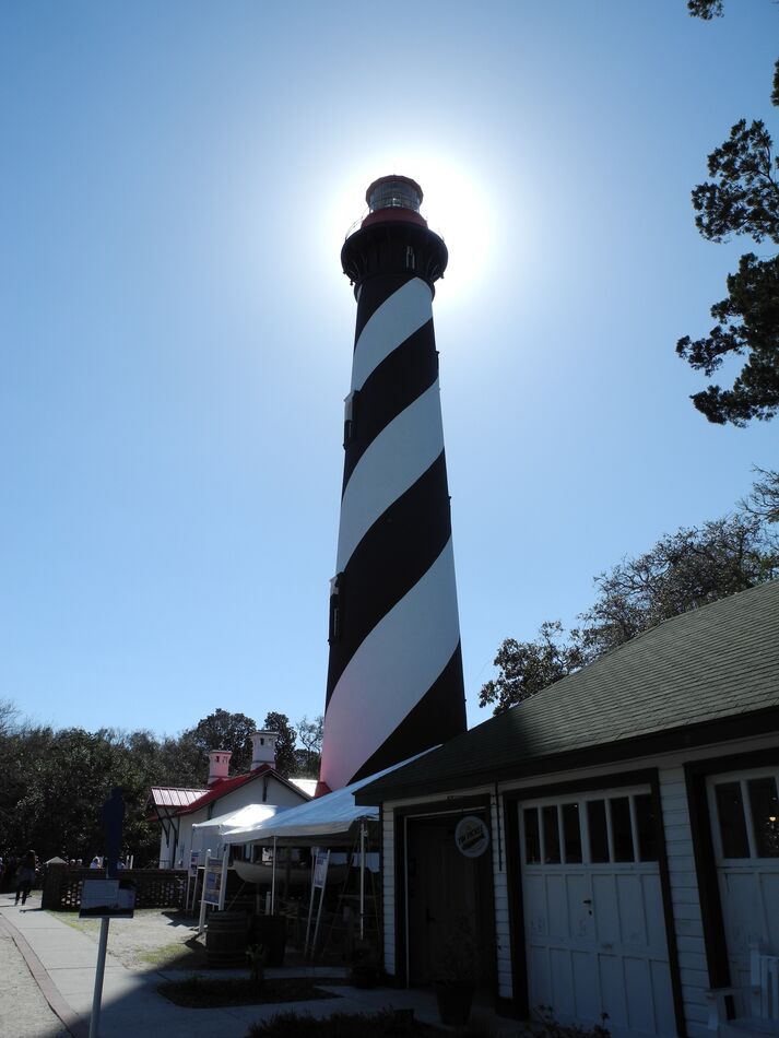 The St. Augustine lighthouse with the sun directly...