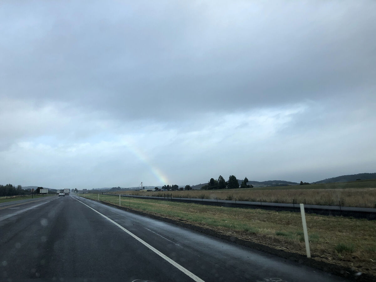 Rainbow over the highway near Willamina, Oregon - ...