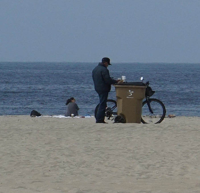 Coffee break by the trash can on the beach!...