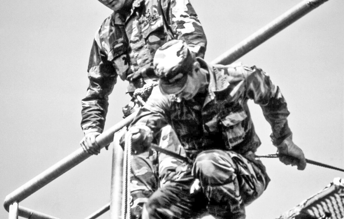 Teaching Showing soldiers of 10th Mtn Div at Ft Drum the basics of rappelling head first over