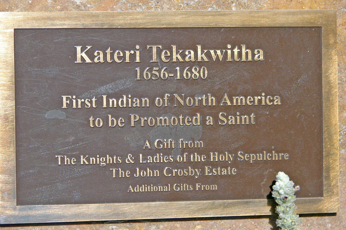 A marker near the statue of Kateri Tekakwitha, in ...