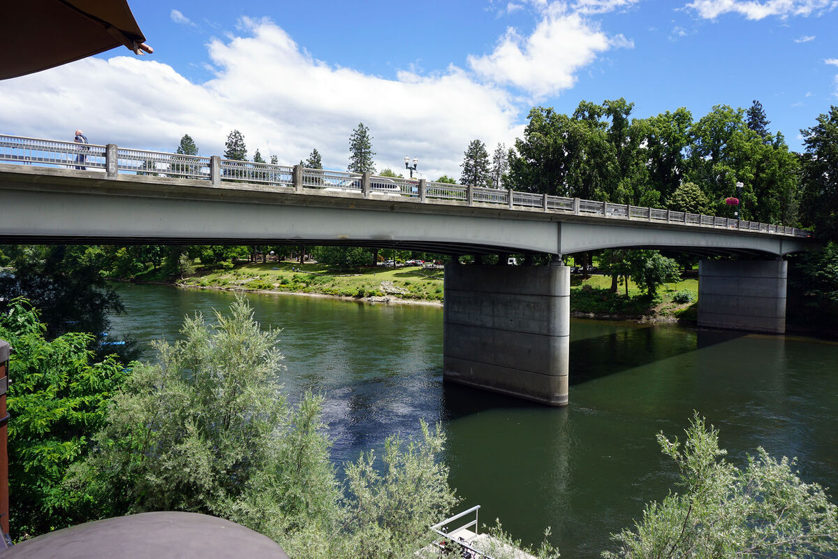 A highway bridge cross the Rogue River, in Grants ...