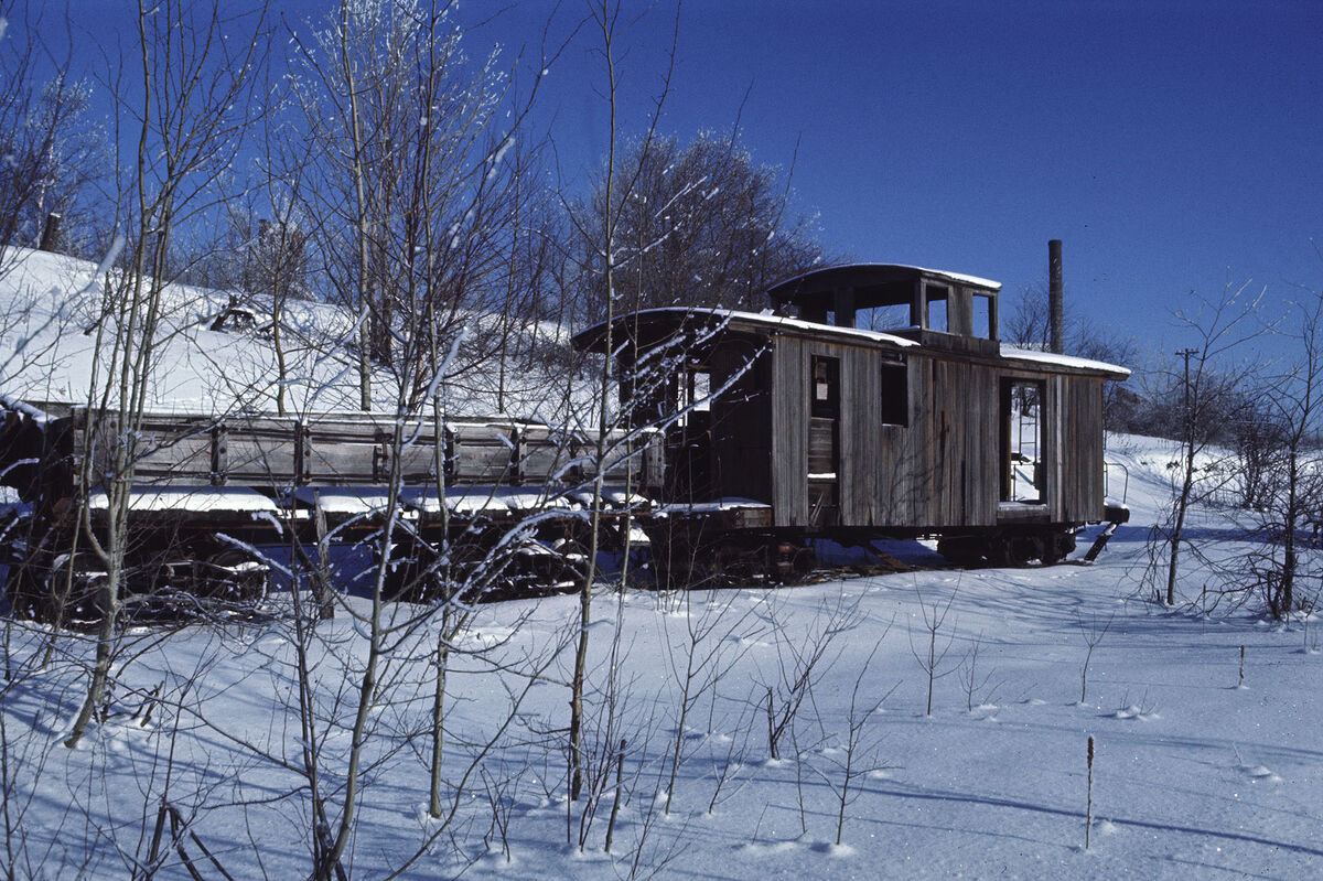 And old caboose and gondola, as seen in the snow o...