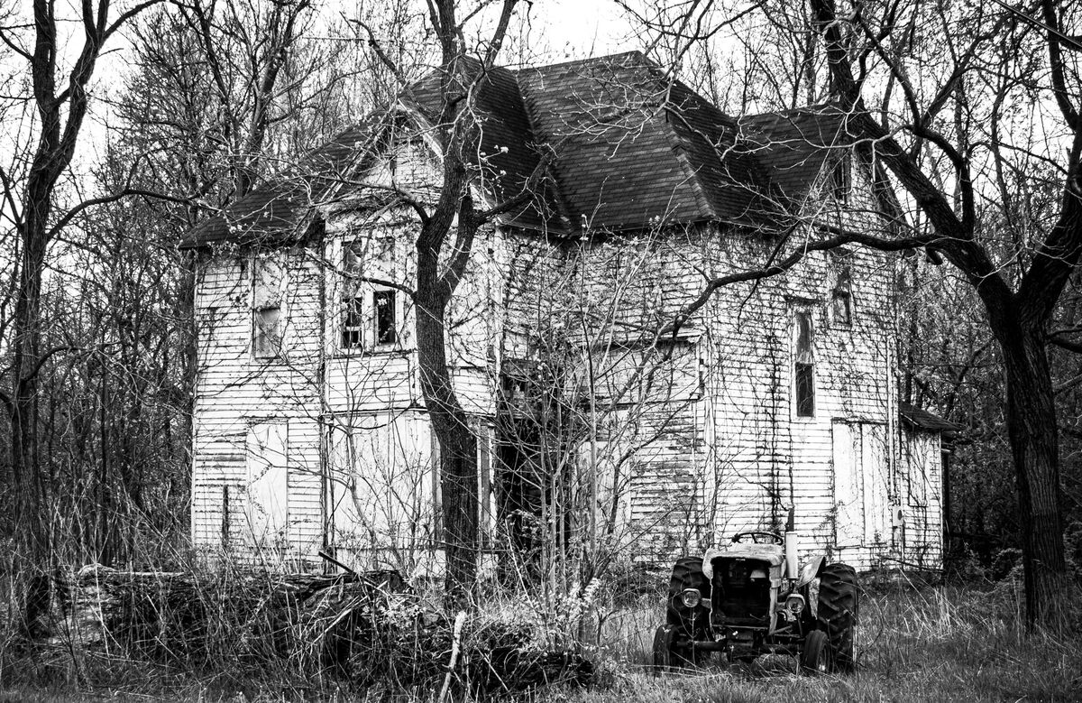 Old House, Old Tractor This old fellow is sitting in a residential