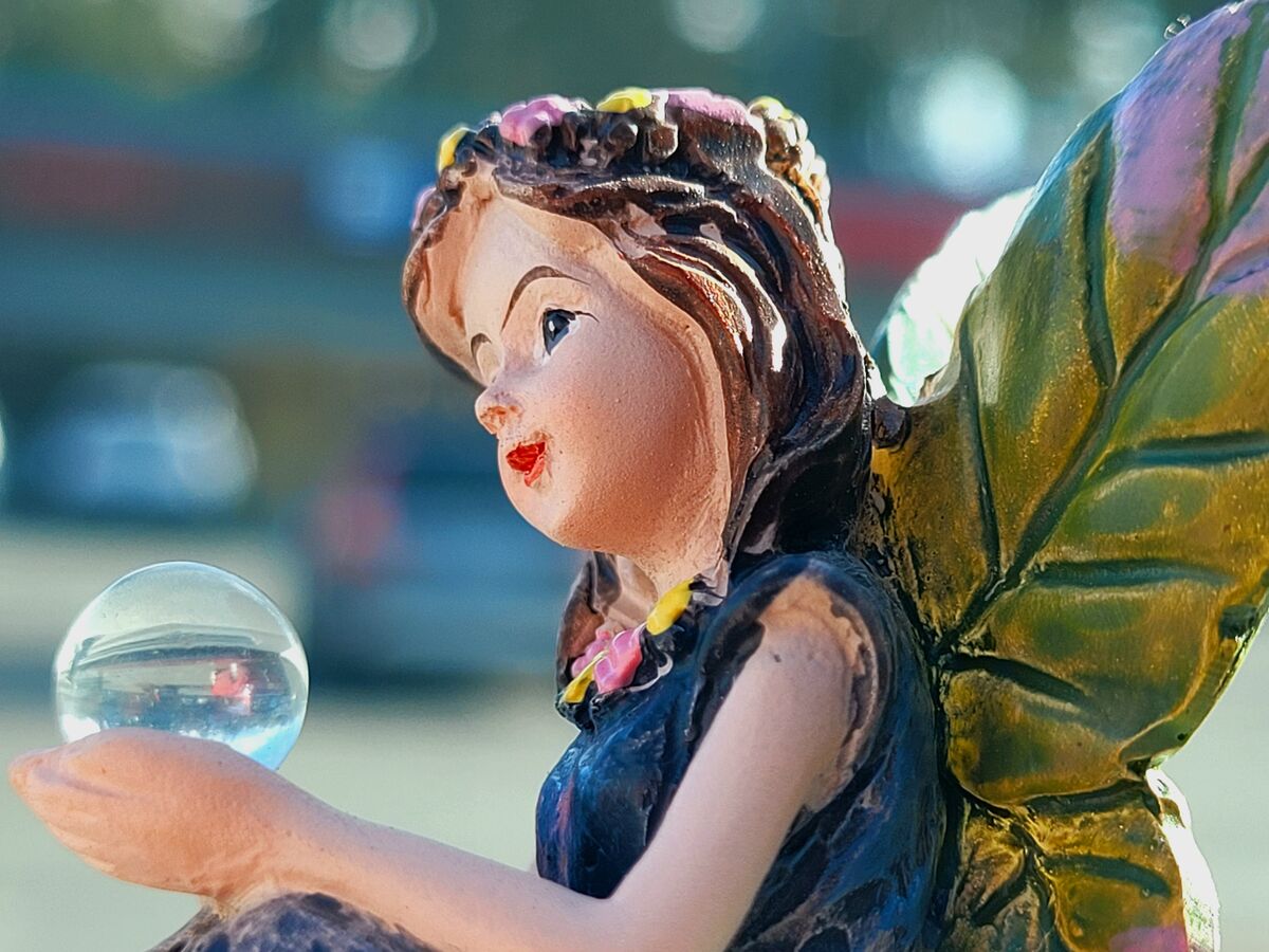 I purchased this fairy because it is holding a tin...