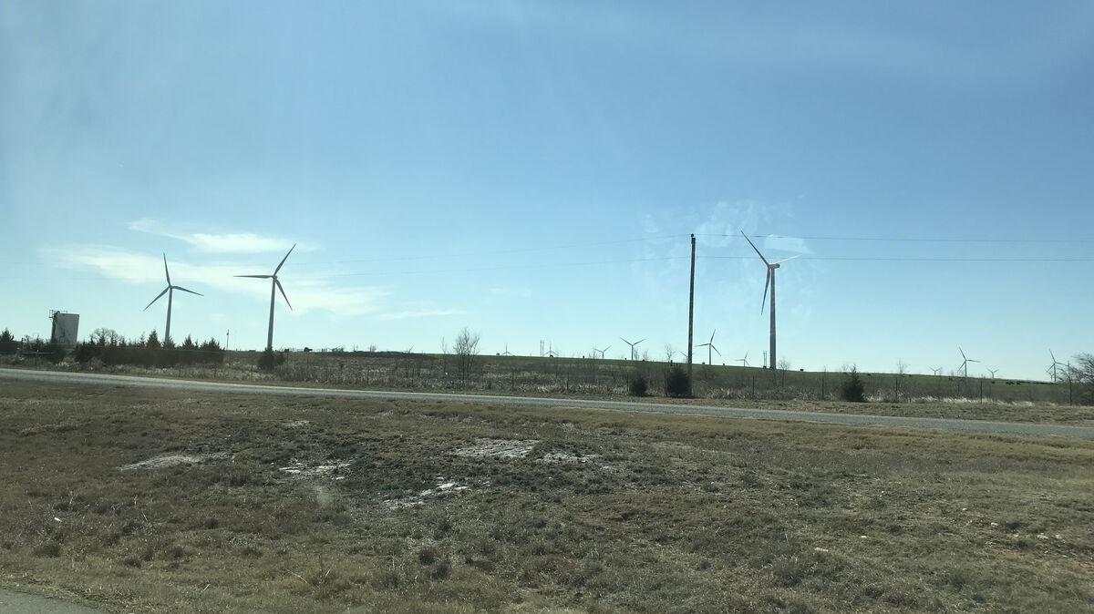 windmills dot the Texas landscape near the major i...
