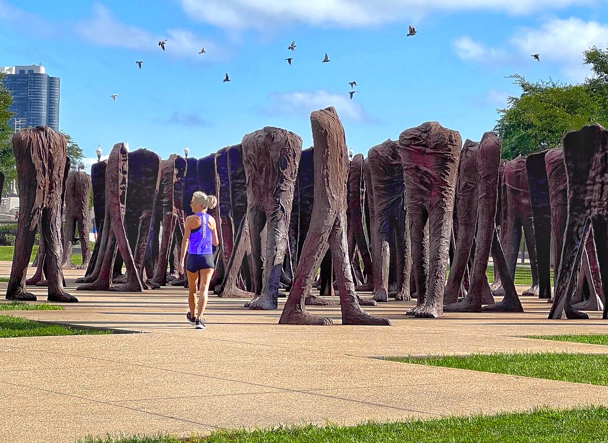 Agora Big Feet Agora is an installation of 106 headless and armless iron sculptures at the Agora Big Feet Agora is an installation of 106 headless and armless iron sculptures at the