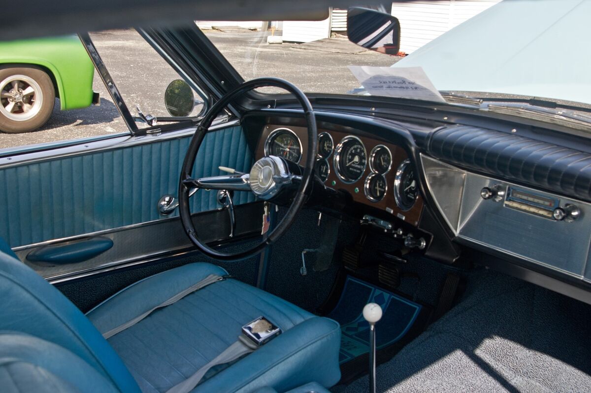 Interior with full set of factory guages and 4-spd...