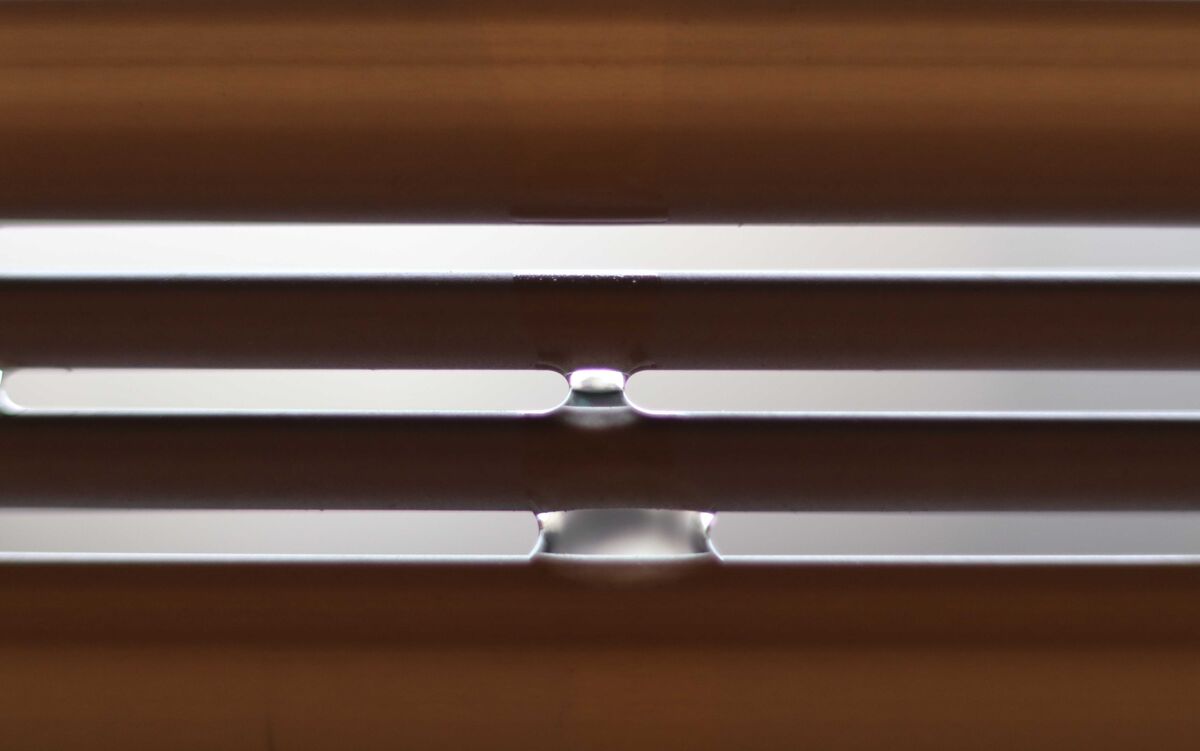 Water droplets on hanging outdoor blind...