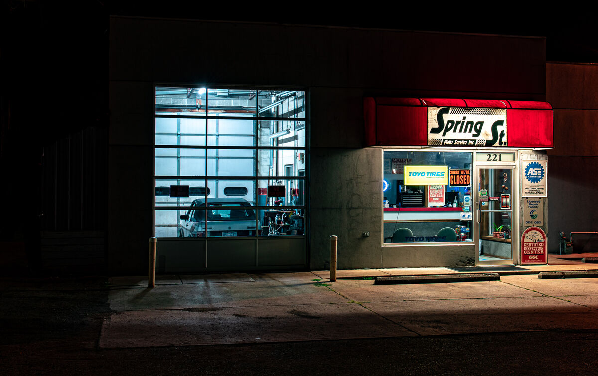 Spring Street Auto repair at night.