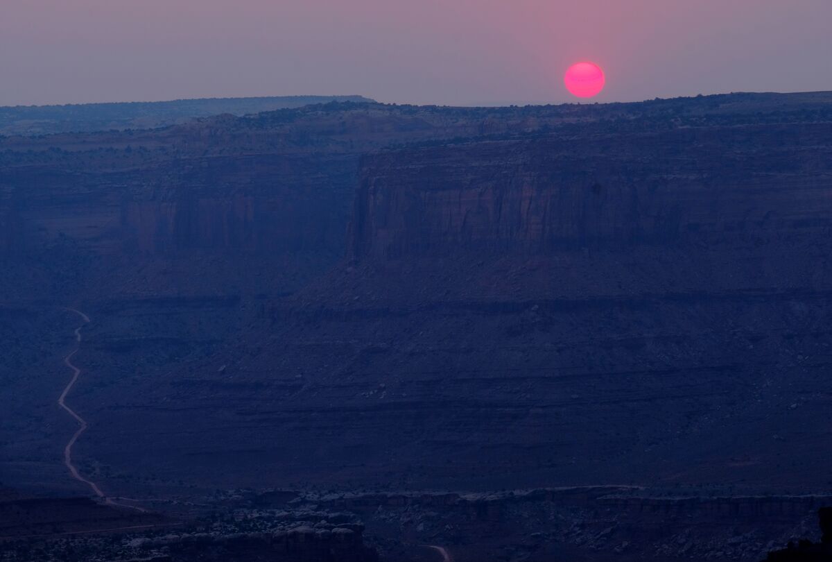 Dead Horse Point Utah Sunset through smoke from fo...