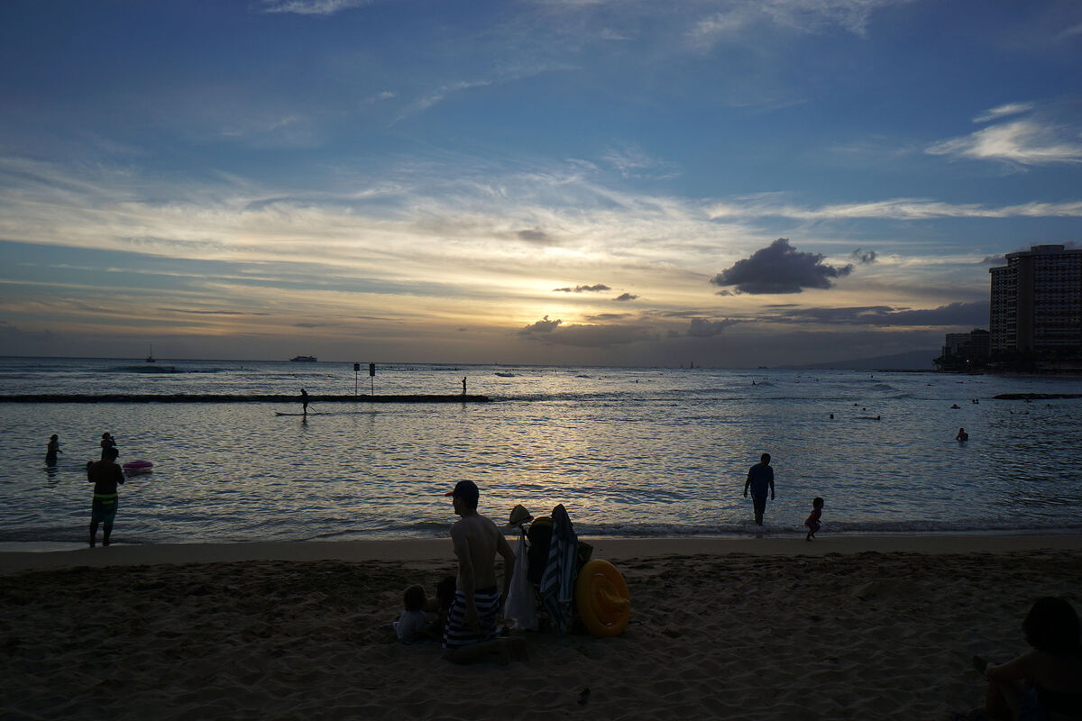 Another shot of a sunset over Waikiki Beach in Hon...