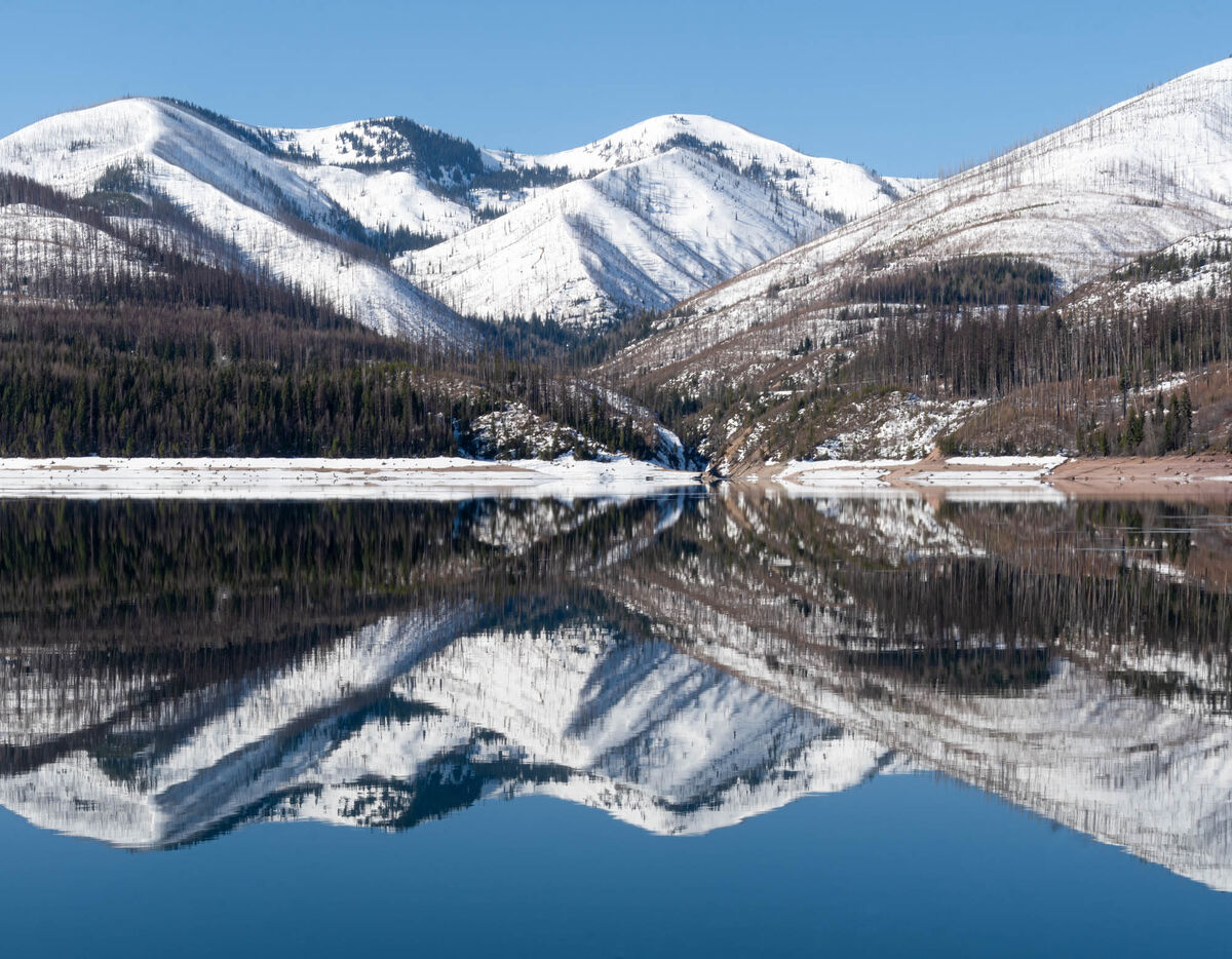 Reflections of the mtns in the Hungry Horse Reserv...
