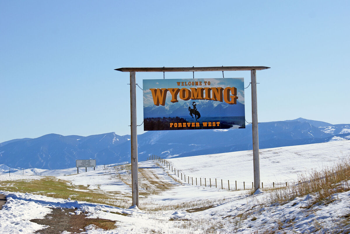 A sign at the border between Montana and Wyoming -...