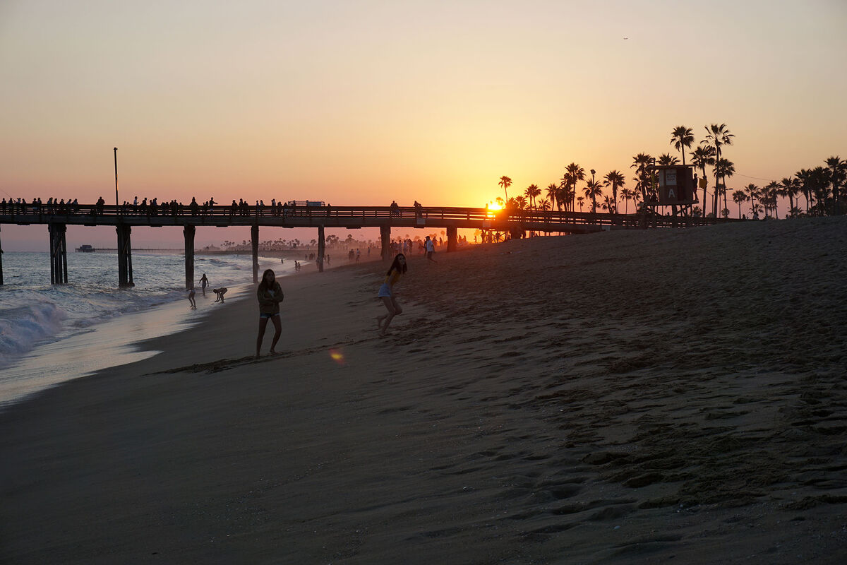 Sunset over the Balboa Pier in Newport Beach, Cali...