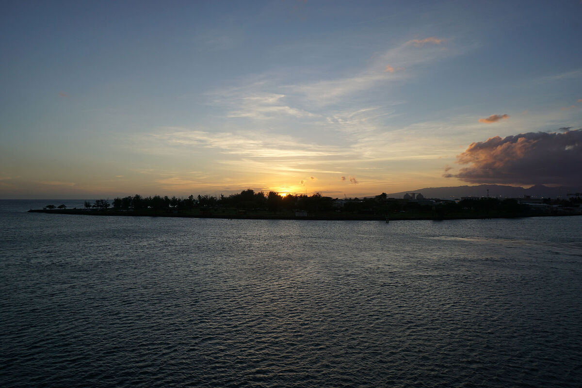 Sunset as seen while leaving the Honolulu Harbor i...
