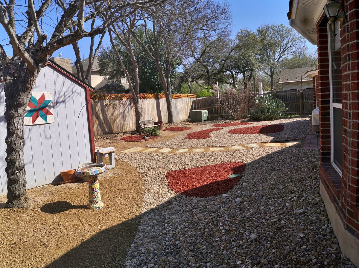 Wednesday the landscaper we hired started Xeriscap...