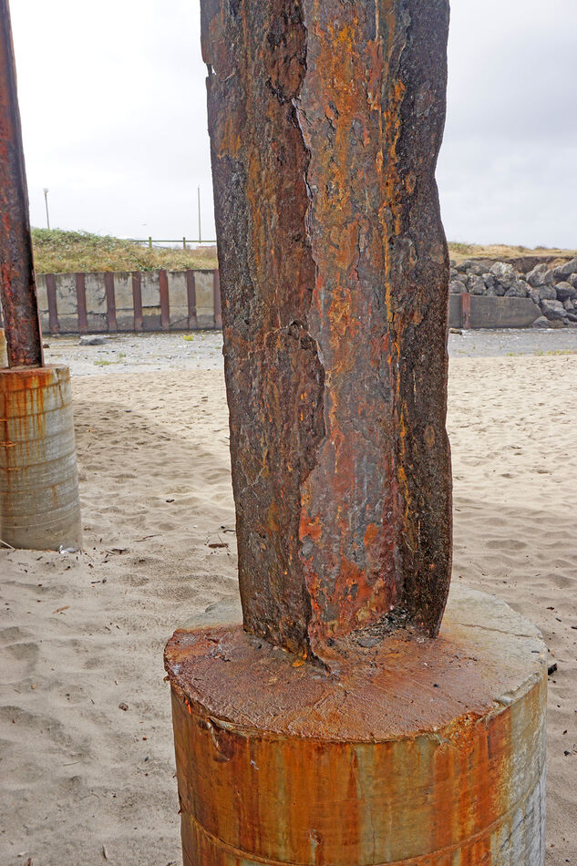 A rusted beam under a pier in Lincoln City, Oregon...