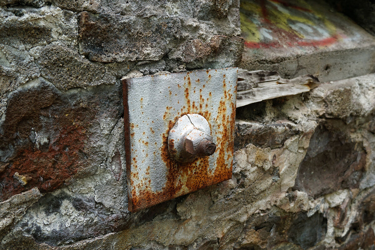 A lag bolt in a wall at the ruins of the Quincy Mi...