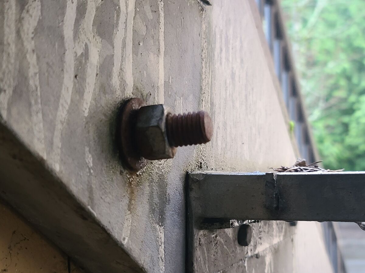 Assembly bolt holding the rail on an external stai...