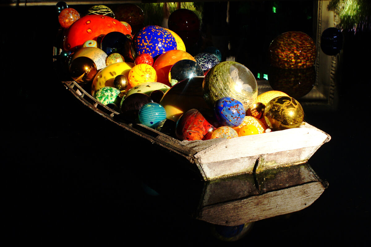 Chihuly ball boat floating on a pool at the Dallas...